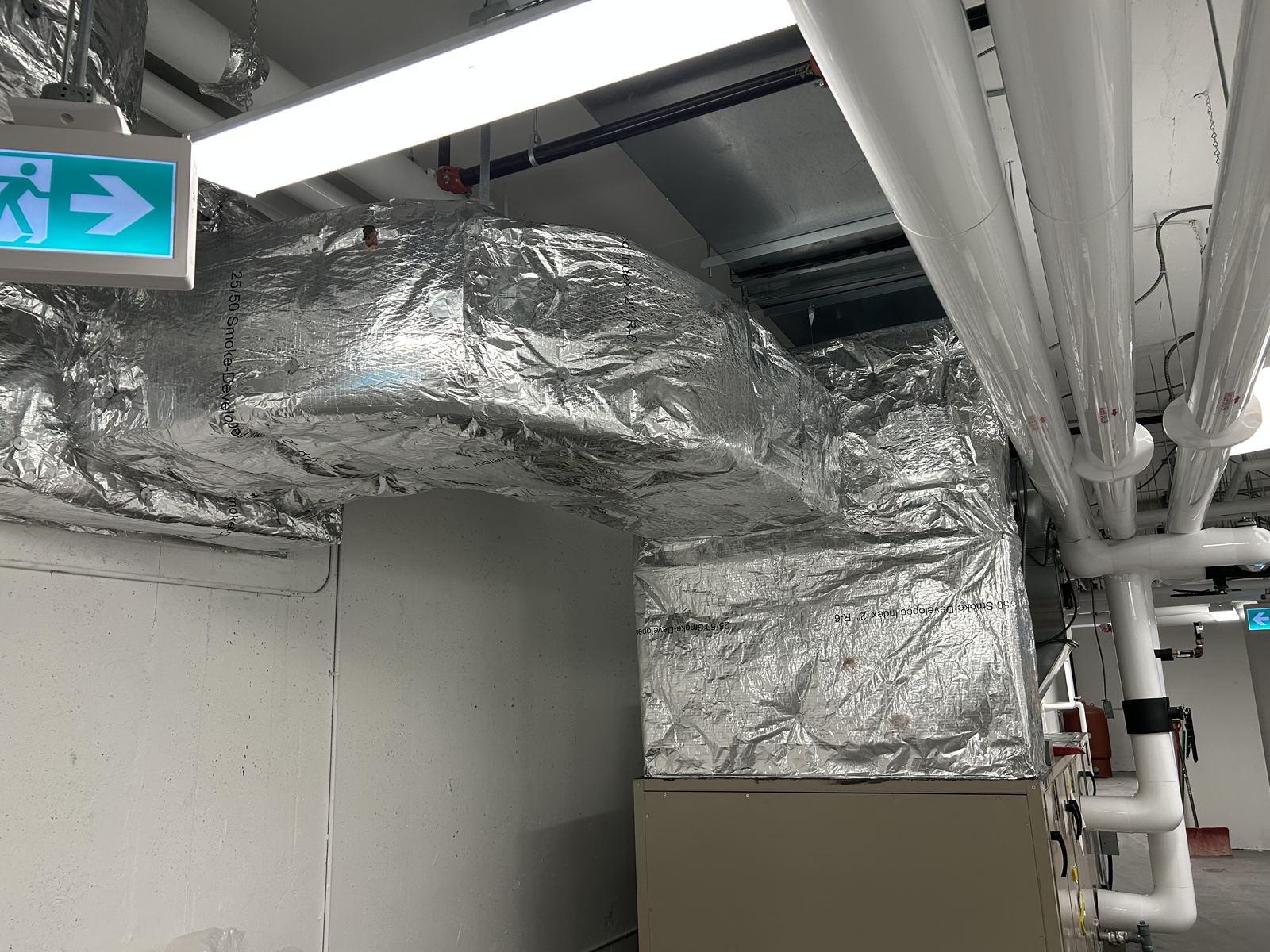 Interior duct wrapped through a corridor ceiling