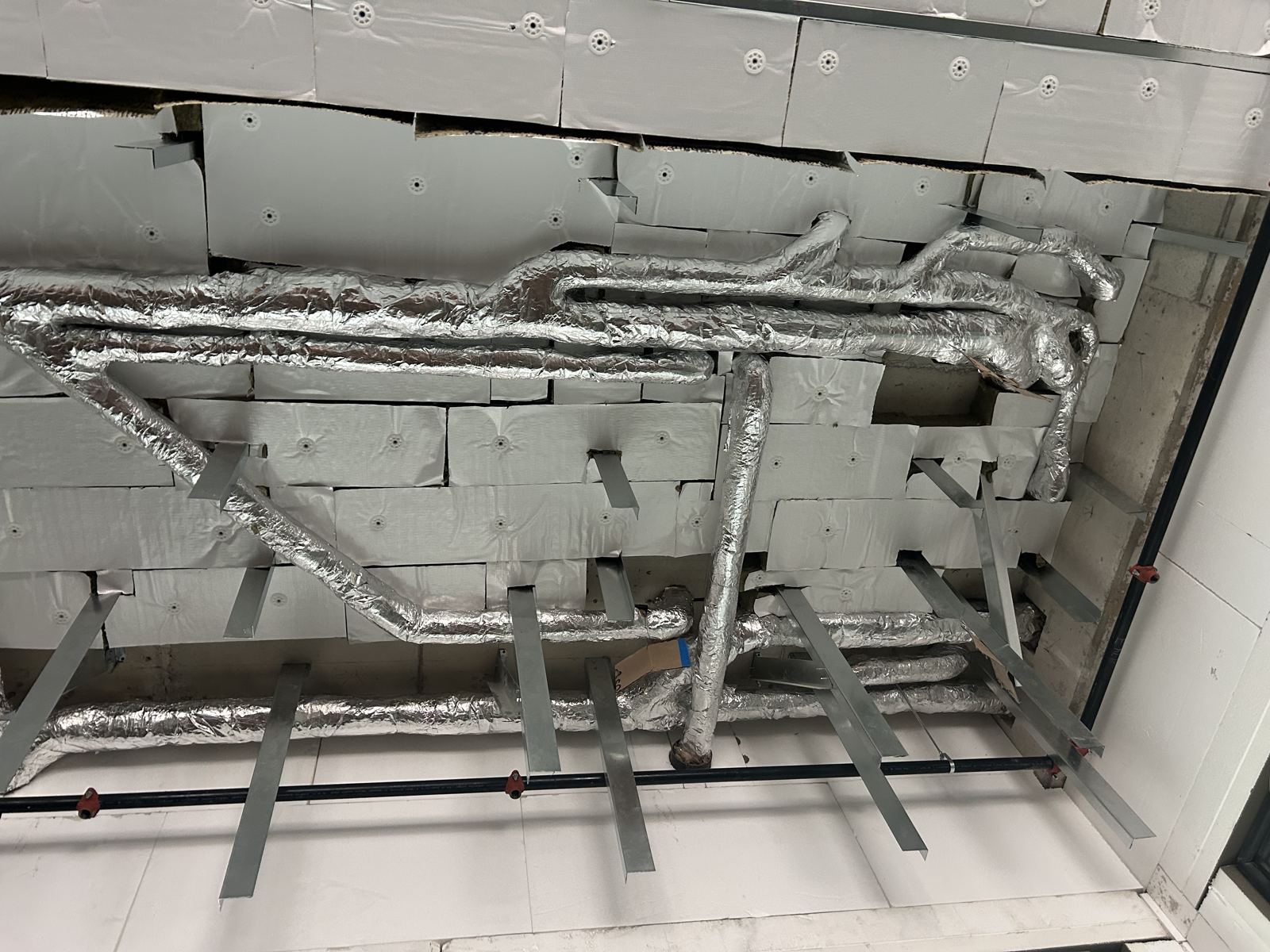 Insulated branch lines across a ceiling