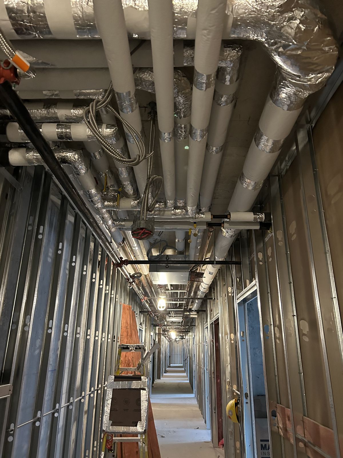 Insulated corridor pipe runs